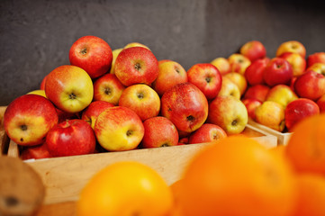 Colorful shiny fresh fruits. Red apples on the shelf of a supermarket or grocery store.