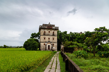 Fototapeta na wymiar July 2017 – Kaiping, China - Kaiping Diaolou in Zili Village, near Guangzhou. Built by rich overseas Chinese, these family houses are a unique mix of Chinese and western architecture