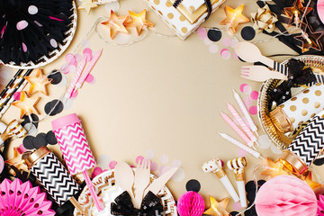 Birthday party background. Gold, black and pink color. Flat lay, top view