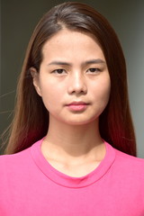 Unemotional Young Filipina Woman