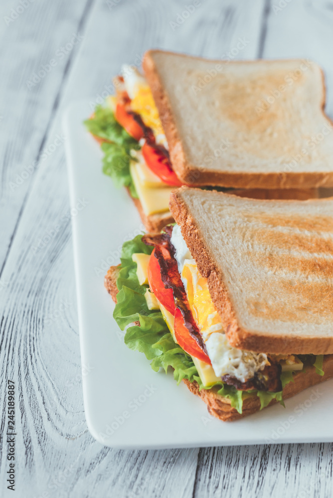 Poster sandwiches with fried egg and bacon