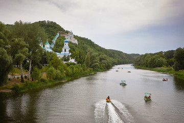 Boats on the Seversky Donets river, Holy Mountains and Sviatogorskaya Lavra at Sviatogorsk.