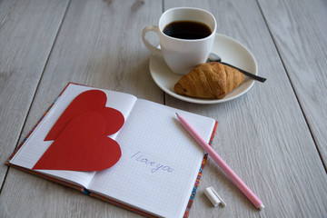 Smartphone mock up flat lay for Valentine's day with coffee cup and chocolate. View from above
