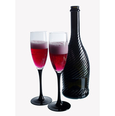 Two glasses of red champagne and a bottle on white. Isolated on white
