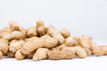 pile of peanuts on white background