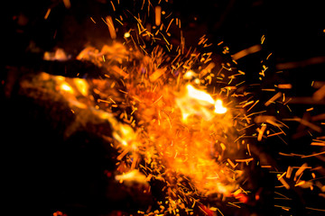 Fototapeta na wymiar Beautiful bonfire with sparks flying upwards, view from above