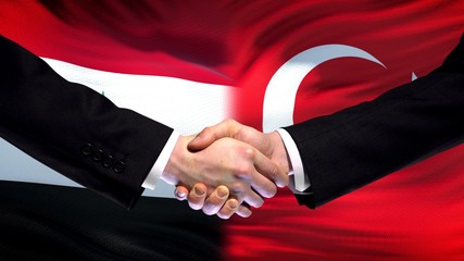 Syria and Turkey handshake, international friendship summit, flag background