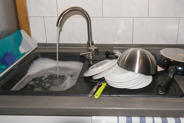 The clogged sink.
