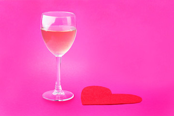 Glass and red paper form of heart for Valentine's Day