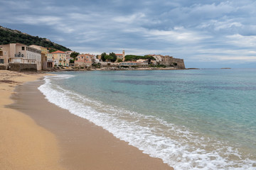 Sandy beach at the Corsican village Algajola, France