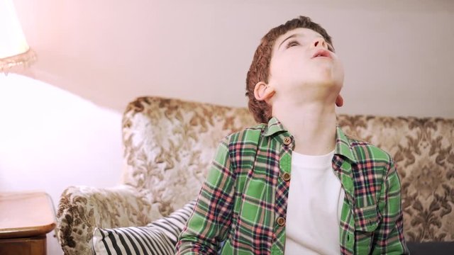 7 years old boy is gargling with herbal decoction