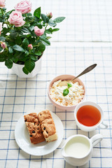 Cheesecakes and cottage cheese with tea. Delicious cheesecake on table. Copy space. Concept of Russian and Ukrainian cuisine. Romantic breakfast. Mother's Day Greeting Card. Healthy food. Women's Day