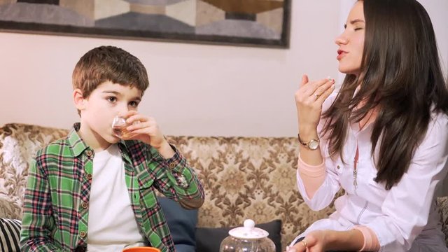 7 years old boy is gargling with herbal decoction