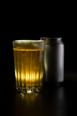 Faceted glass with beer can
