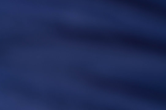 soft blurred mysterious dark blue fabric texture background