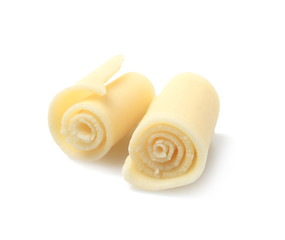 Yummy chocolate curls for decor on white background