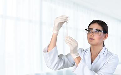 Young female scientist standing in her lab.