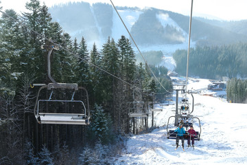 Beautiful mountain landscape with chairlift. Winter vacation