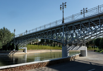 elements and details of the bridge, lights, lantern in the park against the sky