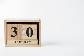 Wooden calendar January 30 on a white background