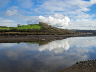 reflections in the River Torridge near Bideford of the Devon countryside