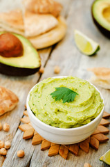 avocado hummus with pita and fresh avocado slices
