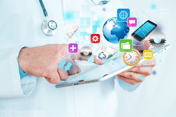 Man holding   digital tablet on background