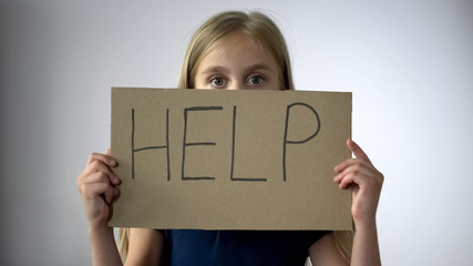 Help sign in little girls hands, assault in family, childrens rights protection