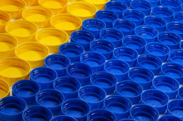 Bottle caps made of HDPE (high-density polyethylene) segregated according to the colors prepared for recycling.