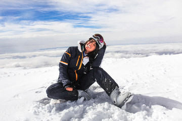 Fototapeta na wymiar woman sit on top of a snow mountain