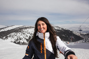 woman stand on top of a snow mountain