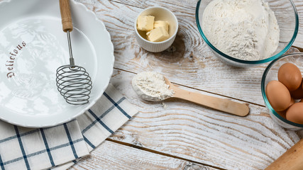 Ingredients and cooking tools for biscuit. Flour, sugar, butter, eggs. white food background. Food...