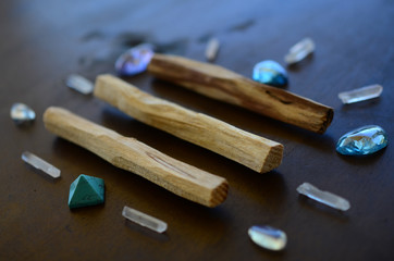 Tumbled healing crystals, shiny bright colors. Rainbow aura quartz, indigo aura quartz, champagne aura quartz, aqua aura crystals. Macro photography with low exposure natural lighting. Crisp colors 