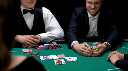 Lucky man winning poker bet in casino, gambling business, entertainment for rich