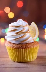 Lemon muffins with protein cream and beautiful lights in a dark key