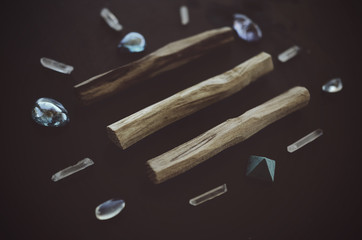 Tumbled healing crystals, shiny bright colors. Rainbow aura quartz, indigo aura quartz, champagne aura quartz, aqua aura crystals. Macro photography with low exposure natural lighting. Crisp colors 