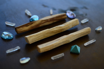 Tumbled healing crystals, shiny bright colors. Rainbow aura quartz, indigo aura quartz, champagne aura quartz, aqua aura crystals. Macro photography with low exposure natural lighting. Crisp colors 