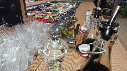 Concept of selling unhealthy food by weight in a store. Vegetables, fruits, meat, salad.