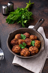 Homemade beef meatballs in frypan