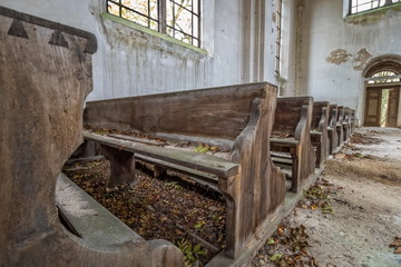 benches in an abandoned church