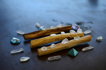 Hipster healing crystal display, bright shiny gems and stones. Witchy crystal healing and meditation. Sacred space, Wiccan alter. Clear quartz, aquaaura, rainbow aura quartz. 