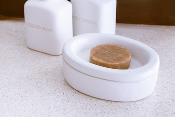 Spa soap in ceramic container dish