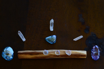 Hipster healing crystal display, bright shiny gems and stones. Witchy crystal healing and meditation. Sacred space, Wiccan alter. Clear quartz, aquaaura, rainbow aura quartz. 