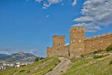 Beautiful Genoese fortress built on rocks above sea in Sudak city of Crimea.