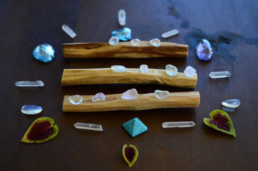 Hipster healing crystal display, bright shiny gems and stones. Witchy crystal healing and meditation. Sacred space, Wiccan alter. Clear quartz, aquaaura, rainbow aura quartz. 