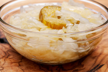 Traditional organic raw and fermented sauerkraut with pickled Persian cucumbers.