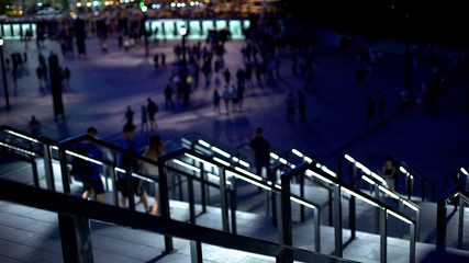 People walking downstairs, leaving stadium after football match, sporting event