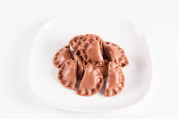 Traditional polish dumplings called pierogi - chocolate flavour with cheese