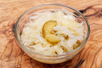 Traditional organic raw and fermented sauerkraut with pickled Persian cucumbers.