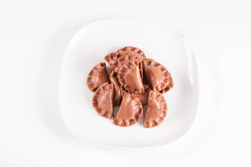 Traditional polish dumplings called pierogi - chocolate flavour with cheese